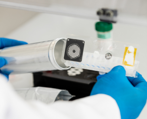 Person holding a BioFire® syndromic pouch.